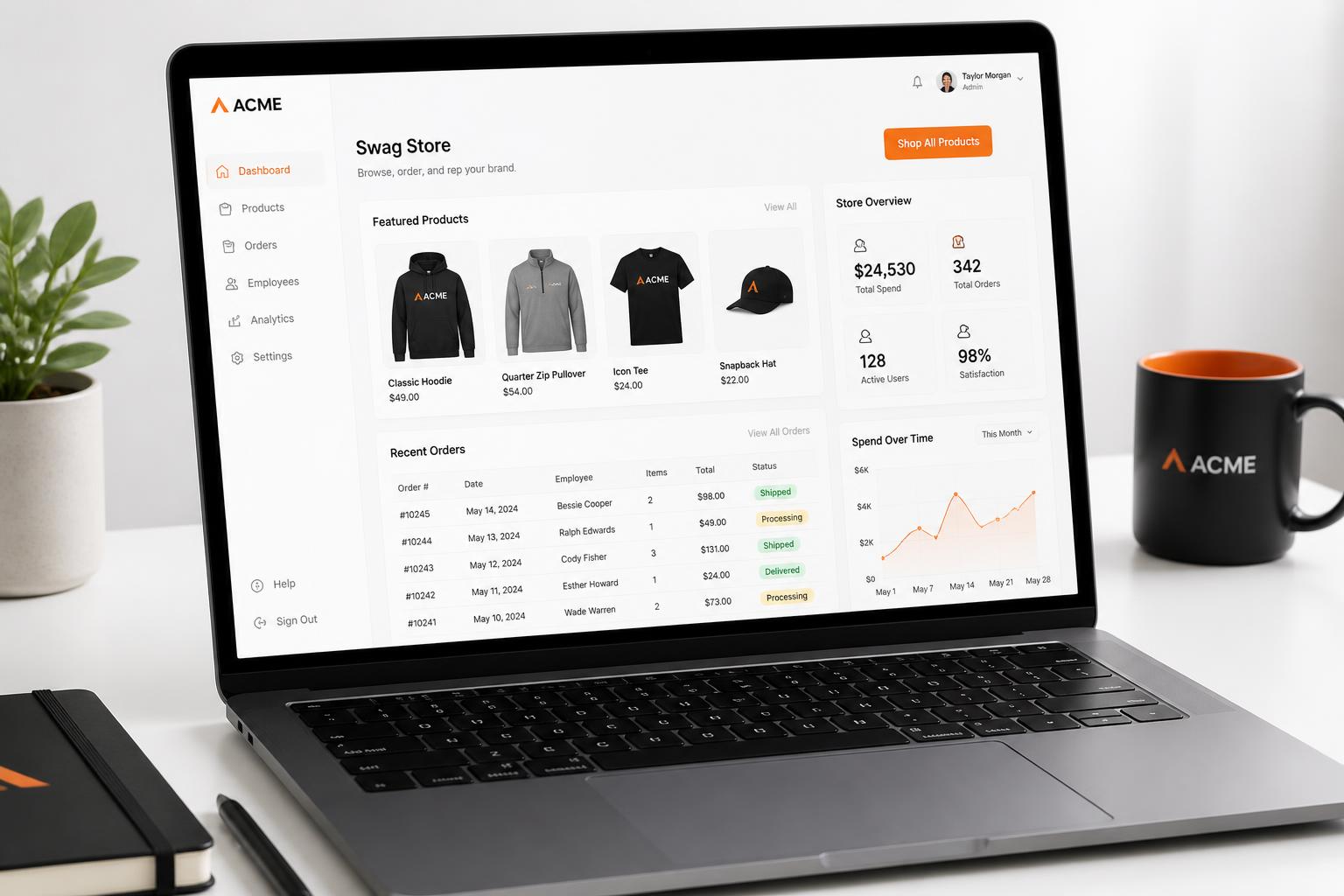 Online company swag store dashboard on a laptop showing branded apparel products, orders and spend analytics